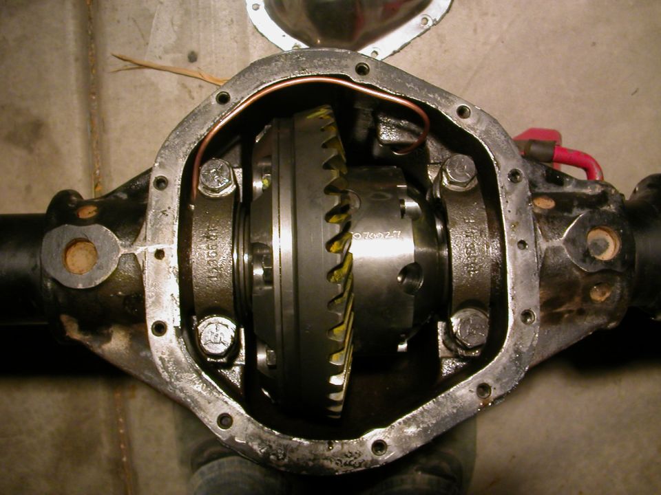Differential housing with internal gears and bolts, showing some wear