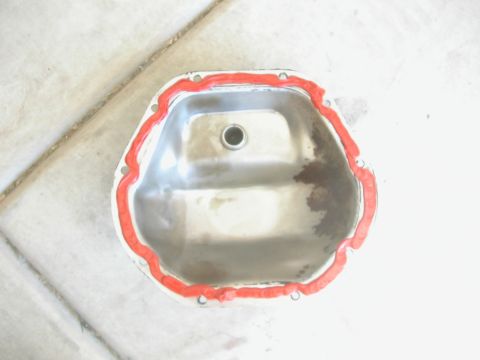 1984 Ford Bronco - Differential cover prepared for installation with red gasket sealant.