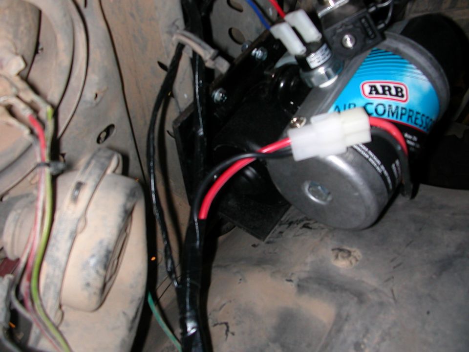 ARB air compressor mounted with wiring, part of an installation
