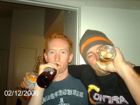 1984 Ford Bronco - Two friends share drinks indoors, with a date stamp indicating the photo was taken on February 12, 2006.