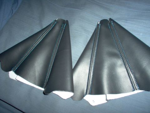 1994 Ford Probe - Pair of aftermarket shift boot covers with contrasting blue stitching are shown.