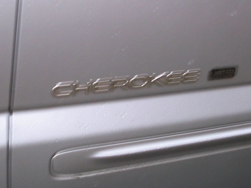 Cherokee badge on silver vehicle door