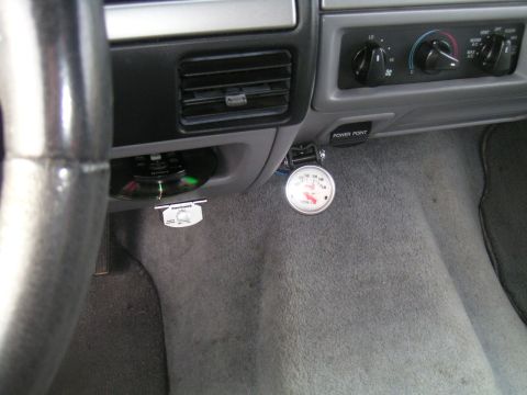 1994 Ford Bronco - Interior view of a 1994 Ford Bronco dashboard, showing a voltmeter gauge and air vents.