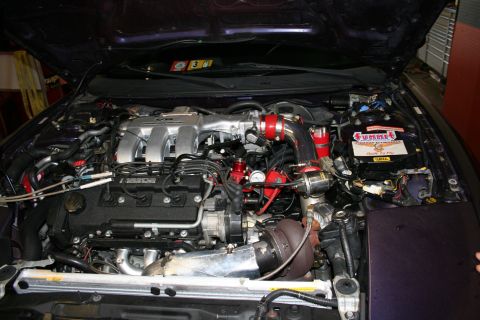 1996 Ford Probe - Engine bay view shows a modified Mazda V6 engine with a turbocharger installed.