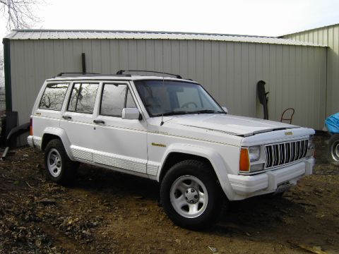 1992 Jeep Cherokee - This 1992 Jeep Cherokee Limited is seen from a three-quarter front angle, parked outdoors.
