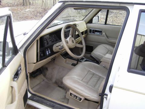 1992 Jeep Cherokee - Interior view of a 1992 Jeep Cherokee, highlighting the tan leather seats and dashboard.