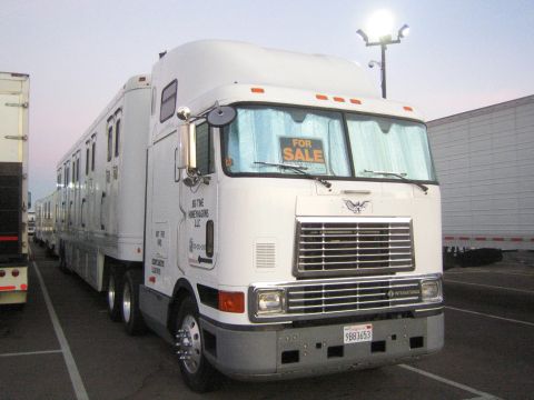 1968 Ford Mustang - Tractor-trailer truck and horse trailer are parked in a lot, with a 'FOR SALE' sign visible.