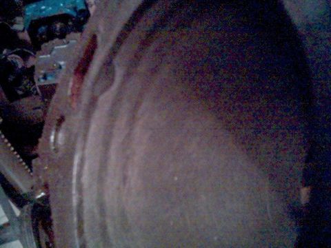 1972 Ford Ranchero - Close-up of a metal engine component with bolt holes, likely from an E85 fuel build.