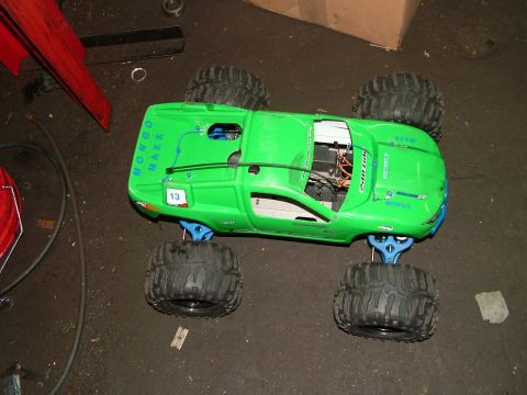 1994 Ford Bronco - This green remote control monster truck features large off-road tires and visible internal components.