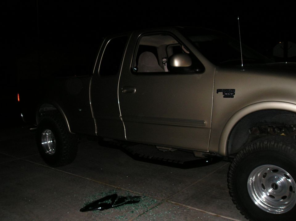 Gold pickup truck side view, F-150 badge visible