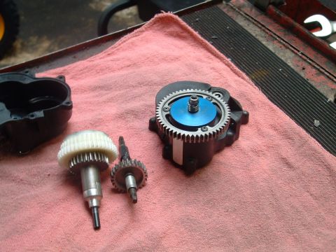 1994 Ford Bronco - Disassembled RC car gearbox parts laid out on a pink cloth.