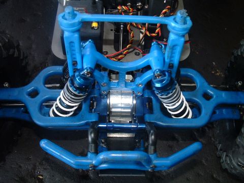 1994 Ford Bronco - Close-up of the suspension system on a remote control car.