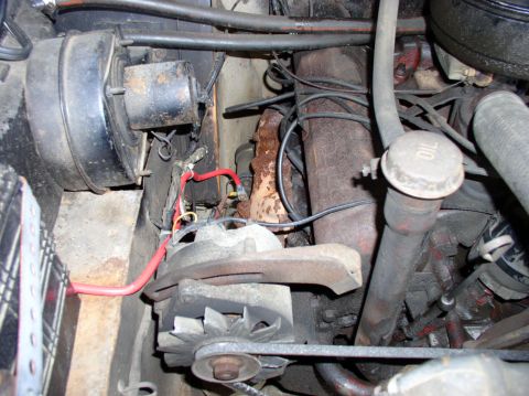 1967 International Scout 800 - Close-up view of engine components including the alternator and brake booster.
