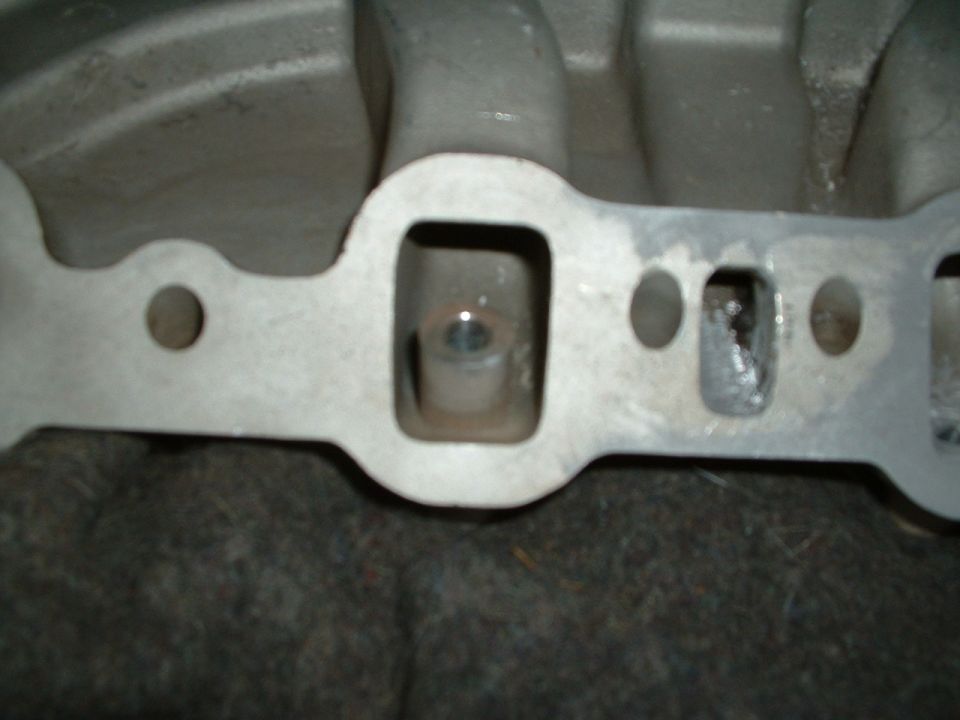 Bottom of injector bung, Excess must be removed and runner shaped to original contour.