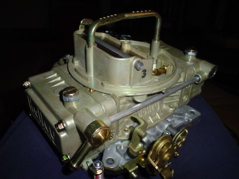 1984 Ford Bronco - A close-up view of a Holley carburetor, a critical engine component.