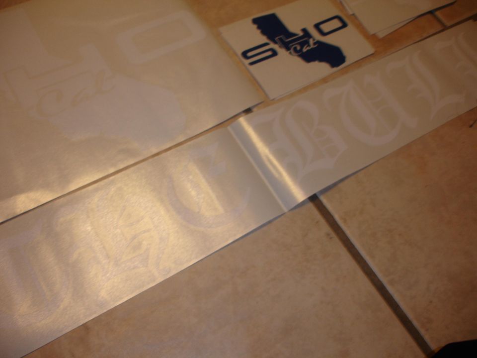 White vinyl decals with gothic lettering and a California map sticker