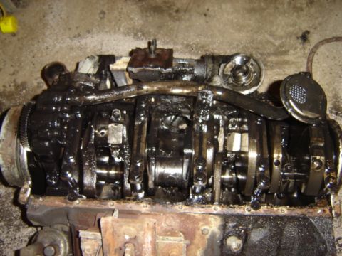 1992 Ford Bronco - Internal view of an engine block, revealing the crankshaft and connecting rod assembly.