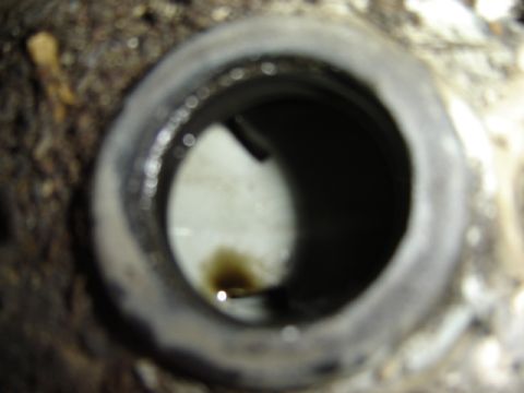 1992 Ford Bronco - Oil visible within a metal component, likely part of an engine or machinery.