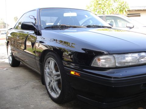1989 Mazda MX-6 - This 1989 Mazda MX-6 coupe is captured in a 3/4 front view, its black exterior.