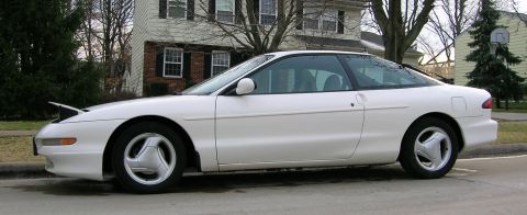 1997 Ford Probe - White 1997 Ford Probe coupe parked curbside on a residential street.