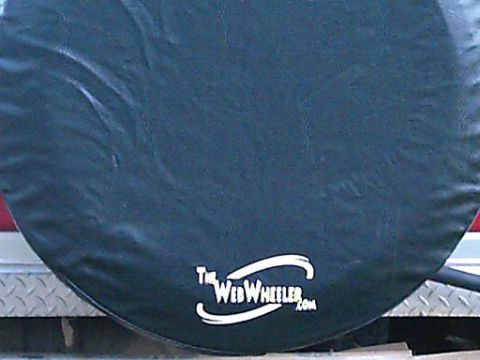 1986 Ford Bronco - A spare tire cover displays the "The WebWheeler.com" logo, suggesting it is part of a vehicle accessory or online community.