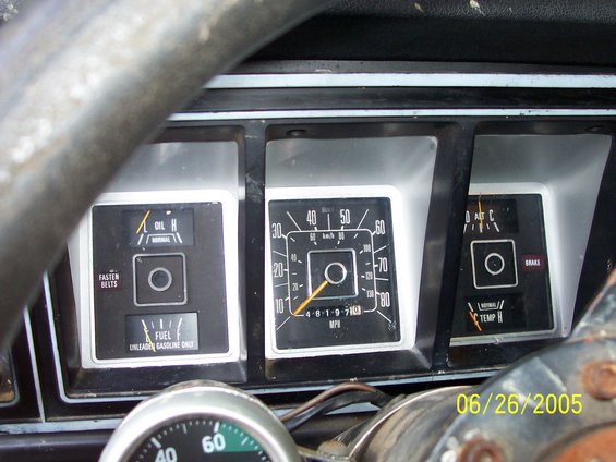 Dashboard gauges including speedometer, oil pressure, fuel, temperature, and brake warning lights