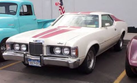 1972 Ford Ranchero - This 1972 Mercury Cougar XR7 features a distinctive grille and dual headlights, with racing stripes on its hood and roof.