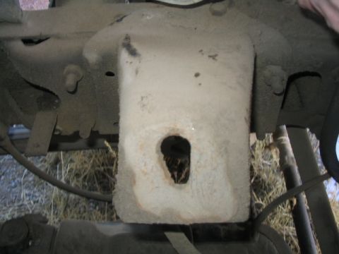 1979 Ford F-150 - This image shows a close-up view of a dusty truck frame component, likely part of the suspension or chassis.