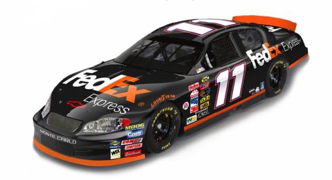 2003 Ford Crown Victoria - A black and orange race car with the number 11 and FedEx Express branding is shown from a three-quarter front angle.