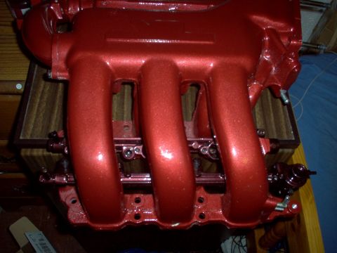 1994 Ford Probe - A red metallic painted intake manifold is shown, likely a performance upgrade part.