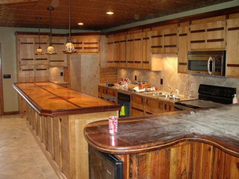 1995 Ford Bronco - Interior view of a kitchen custom wood cabinetry and a large bar area.