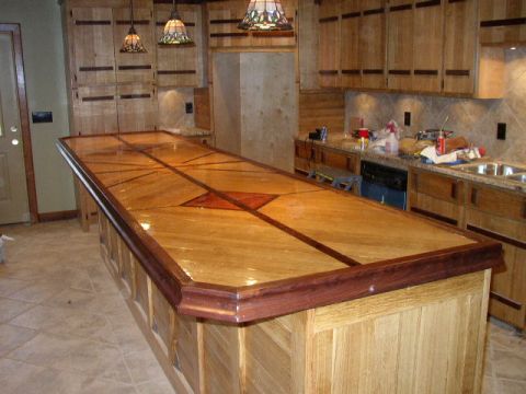 1995 Ford Bronco - Custom kitchen island with a detailed wood inlay countertop and surrounding cabinetry.
