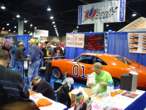 1984 Ford Bronco - The General Lee, a 1969 Dodge Charger from Dukes of Hazzard, is on display at a car show.