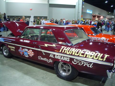 1984 Ford Bronco - This classic Ford Thunderbolt drag car features custom racing decals and lettering on its side.