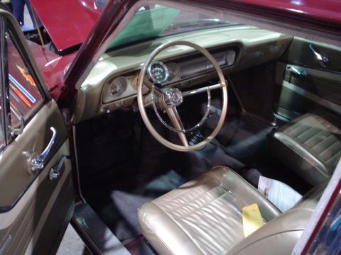 1984 Ford Bronco - Interior view of a classic car, showing tan upholstery and dashboard details.