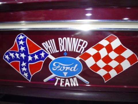 1984 Ford Bronco - Decal on a maroon vehicle reads 'Phil Bonner Ford Team' with a Confederate flag and a checkered flag.