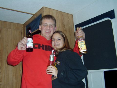 1998 Jeep TJ - A couple poses for a photo while holding alcoholic beverages.