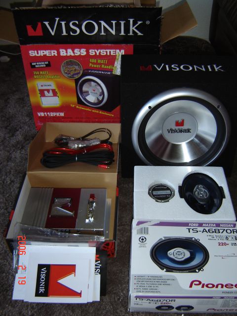 1993 Ford Bronco - Car audio components including Visonik and Pioneer speakers, a subwoofer, and an amplifier are displayed.