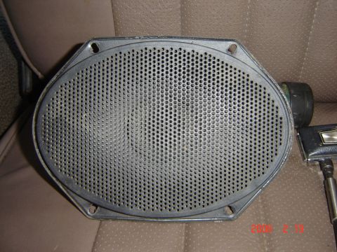 1993 Ford Bronco - Speaker shown on a textured seat, with a microphone stand visible on the side.