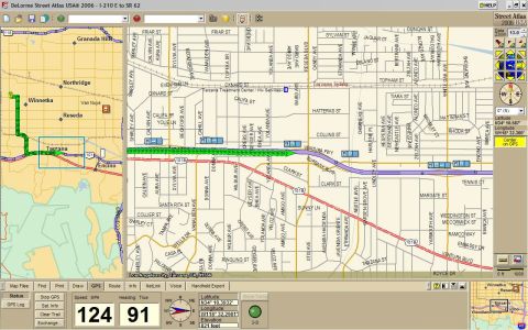1995 Ford Taurus - GPS navigation screen shows a map with a highlighted route and current speed and heading.