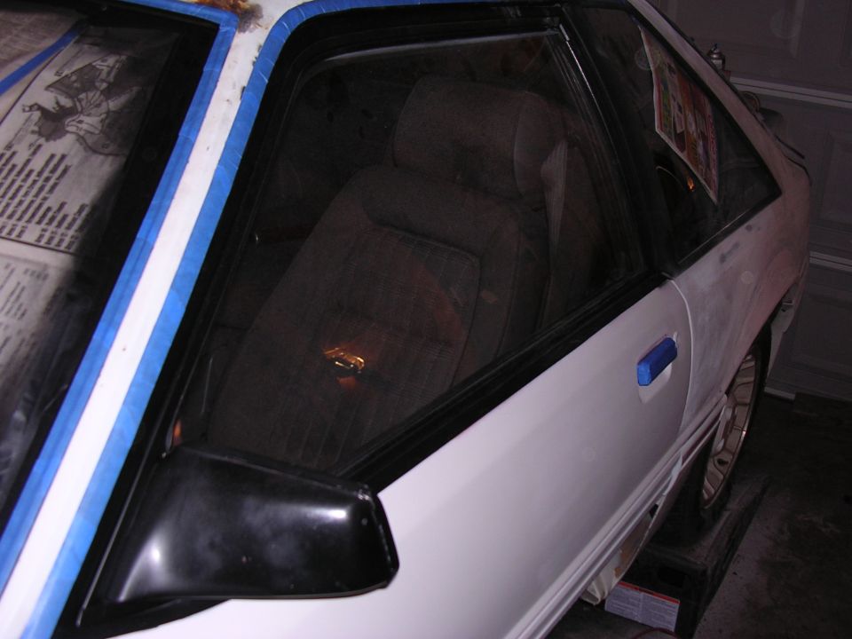 1988 Ford Mustang interior and side, white