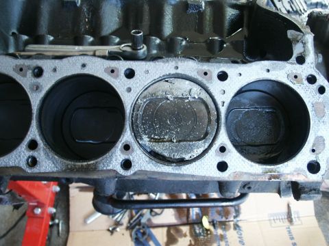 1991 Ford Bronco - Close-up view of an engine block's cylinders and pistons, suggesting internal engine work.