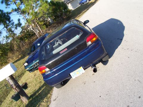 1994 Ford Probe - Rear view of a blue 1994 Ford Probe hatchback parked on a street.