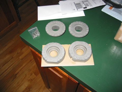 1991 Ford Explorer - Four-wheel drive locking hubs and hardware are laid out on a green countertop.