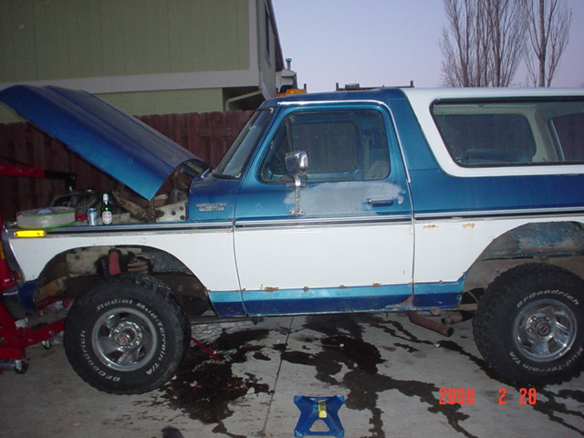1978 Ford Bronco, blue and white, side view, hood open, rust on lower body panels
