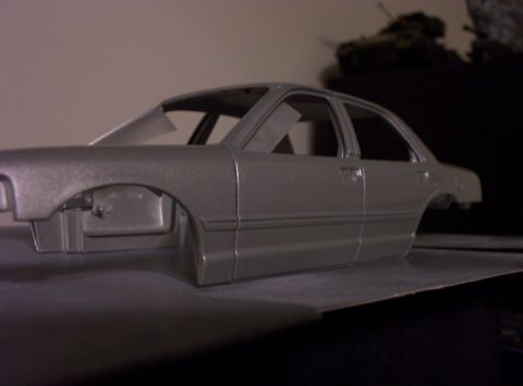 1998 Ford Crown Victoria - Unfinished model car body shown from the side.