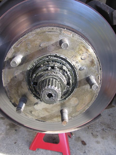 1987 Ford Bronco - Front wheel hub and brake rotor assembly, likely requiring maintenance or replacement.
