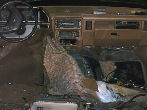 1991 Ford Bronco - Interior of a 1991 Ford Bronco undergoing wiring work, with the dashboard disassembled.