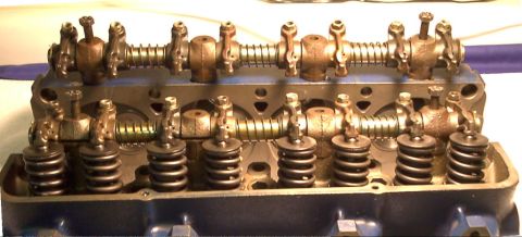 1964 Ford Fairlane - Close-up view of an engine cylinder head with its internal valve train components visible.