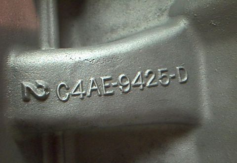 1964 Ford Fairlane - A close-up shows the casting number C4AE-9425-D on a metal automotive part.
